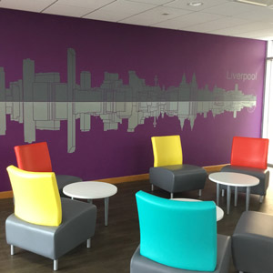 Break room with coloured chairs and tables